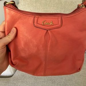Salmon colored Coach purse